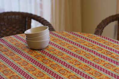provencal french tablecloth with orange and green tones