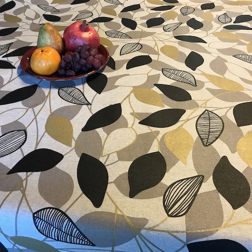 black and gold coated tablecloth