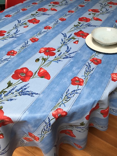 french provincial tablecloth with red poppies on a sky blue background