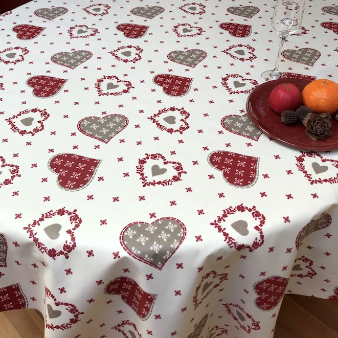 Coated christmas tablecloth with red and white hearts